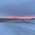 Snowy road at dusk